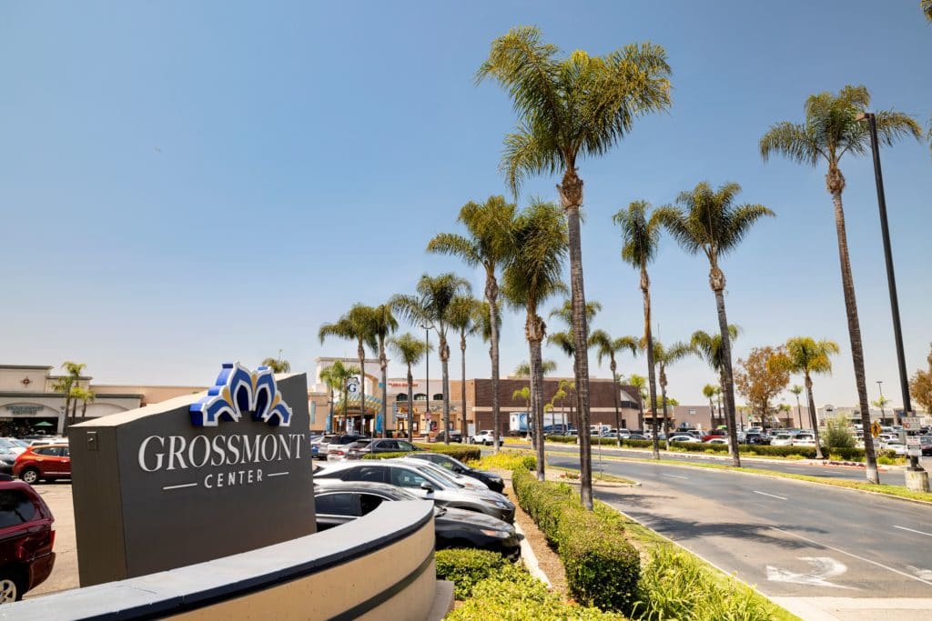 grossmont center entrance signage next to palm trees